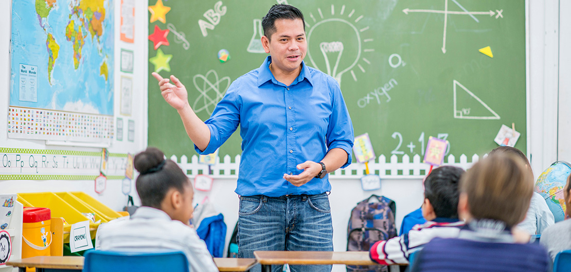 Image of teacher teaching a classroom of students